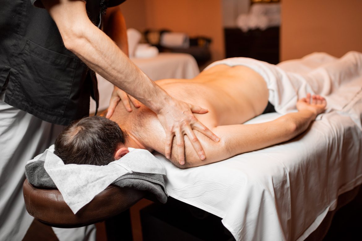 Man receiving a deep massage